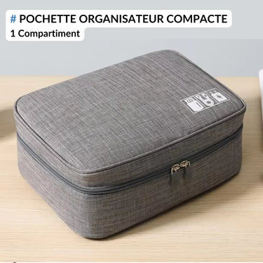 Pochette organisateur compacte grise avec fermeture éclair et 1 compartiment, idéale pour ranger des accessoires électroniques comme cùbles, chargeurs et gadgets. Design élégant et fonctionnel.